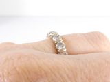a close up of a person ' s hand with a ring on it