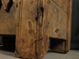 an old wooden bed with a wooden frame on the floor