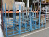 a lot of blue metal racks in the middle of a parking lot