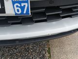 a close up of the front of a car with a license plate on it