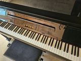 a piano that is sitting in a room