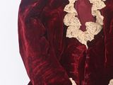 maroon velvet jacket with ruffles and lace trim
