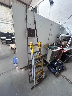 a ladder leaning against a wall in a garage