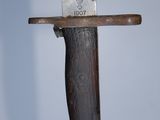 a knife that is on top of a wooden stand
