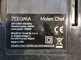 a close up of a metal object with a sign on it
