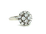 an image of a diamond clustered ring on a white background