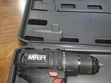a black and red drill in a case on a table