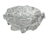 a glass ashtray with a decorative design on it