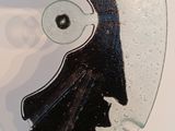 a glass sculpture of a man ' s face on a table