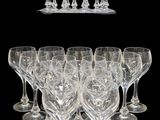 a lot of empty wine glasses on a black background
