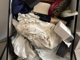a box full of clothes and a brush in it