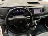 dashboard of a car with a steering wheel and dashboard controls