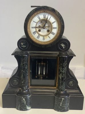 a clock that is sitting on top of a table
