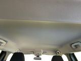 a view of the back of a car with the sun shining through the window