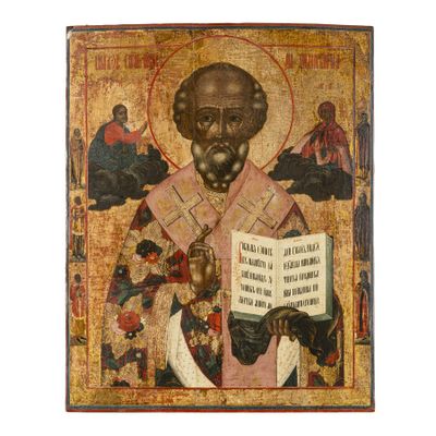 un tableau représentant un vieil homme tenant un livre entre ses mains