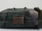an old suitcase that is sitting on a white surface