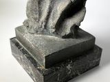 sculpture of a woman ' s head on a marble base