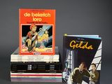 three books are stacked on top of each other on a table