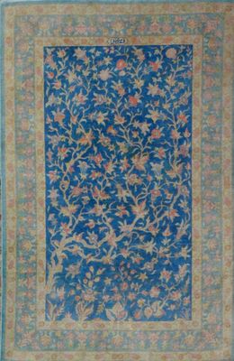 a blue rug with a floral design on it
