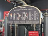 a gym room with a row of machines and other equipment