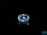 a blue diamond on a black background