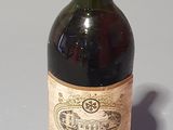 a bottle of wine that is sitting on a table