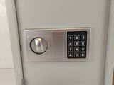 a small safe box with a key lock on it