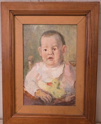 tableau représentant un bébé avec un bol de fruits, dans un cadre en bois