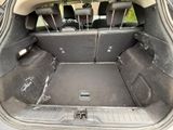 a trunk of a car with the back seats folded down