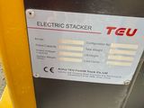 an electric sticker on the side of a parking meter