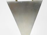a close up of a metal object on a white surface