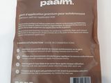 a close up of a bag of palm oil on a white surface