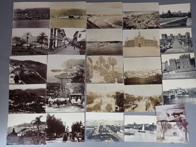 several old black and white photos of a bunch of buildings