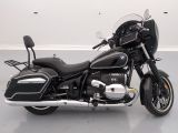 a black motorcycle that is parked in a room