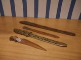four different types of knives on a table