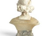 marble bust of a woman on a pedestal with a white background