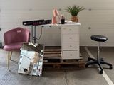 two chairs and a desk in a garage