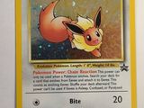an image of a pokemon card with a picture of eevee