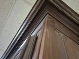 a close up view of a wooden door with a metal handle