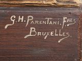 an old wooden box with writing on it sitting on top of a table