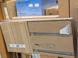 many boxes stacked on top of each other in a store
