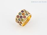 an image of a gold ring with multi colored stones on it