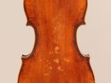 an old violin with a wooden back and a long neck