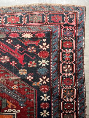 a close up of a rug on a wooden floor