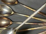 a lot of spoons that are sitting on a table