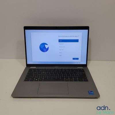 an open laptop computer sitting on top of a white table