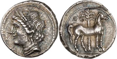 a silver coin with an image of a horse on it