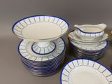 a lot of plates and bowls on the table