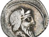 une pièce d'argent à l'effigie d'un homme barbu