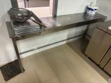 a stainless steel sink in a kitchen with a stainless steel counter top